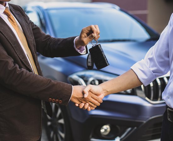 car-salesman-make-a-deal-and-hand-over-the-key-qgpkhp0lycsshbufp5duhgl3rswkjr762r2v1kf3f8